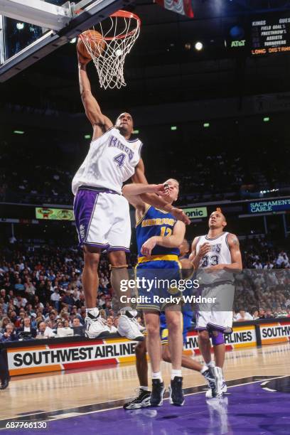 Corliss Williamson of the Sacramento Kings dunks against the Golden State Warriors circa 1996 at Arco Arena in Sacramento, California. NOTE TO USER:...