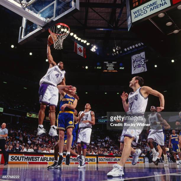 Corliss Williamson of the Sacramento Kings dunks against the Golden State Warriors circa 1996 at Arco Arena in Sacramento, California. NOTE TO USER:...