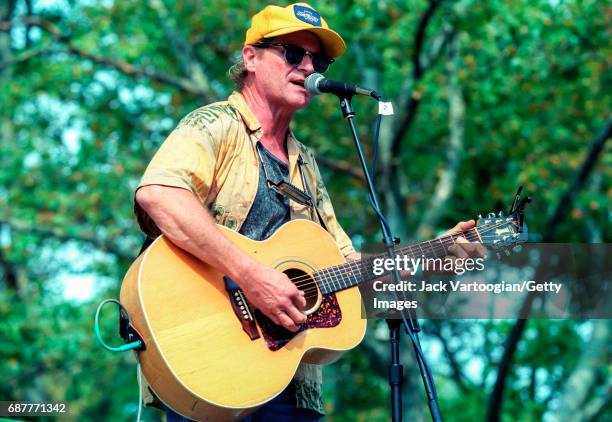 American Country and Folk musician Butch Hancock plays guitar as he performs on stage at Central Park SummerStage, New York, New York, July 31, 1999.