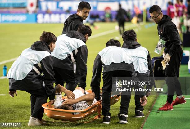 Koki Ogawa of Japan lies injured next to the pitch during the FIFA U-20 World Cup Korea Republic 2017 group D match between Uruguay and Japan at...