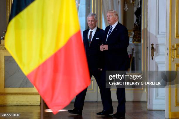 President Donald Trump speaks with King Philippe of Belgium prior to a meeting at the Royal Palace in Brussels, on May 24, 2017. US President Donald...