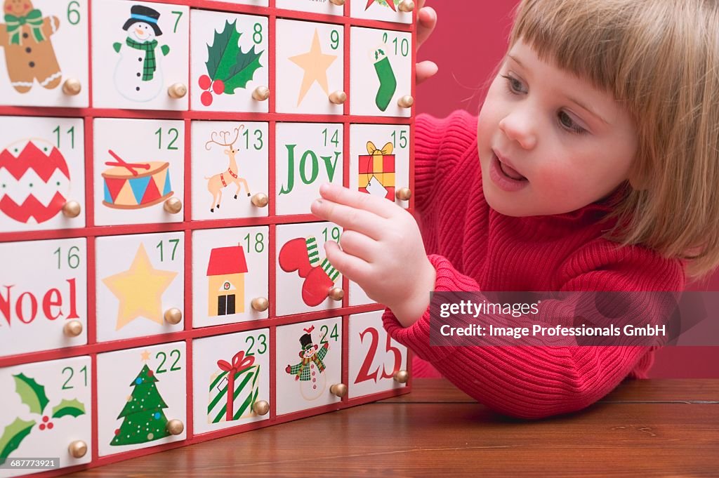 Small girl with Advent calendar