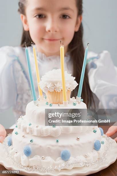 little girl dressed as princess with birthday cake - princess cake stock pictures, royalty-free photos & images