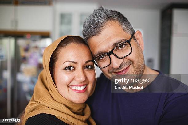 portrait of happy couple at home - voile religieux photos et images de collection