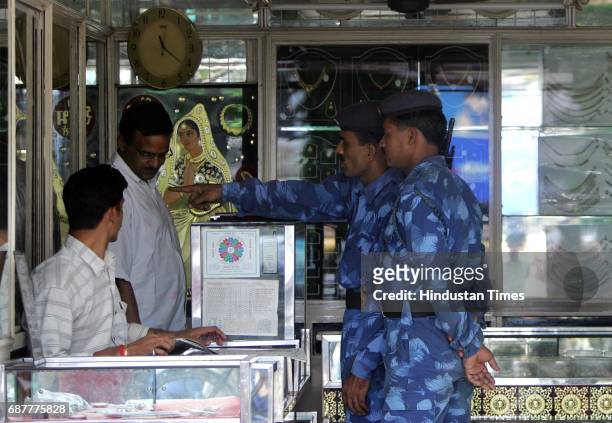 Gold and Jewellery - RAF Personnel look at items at a Jewllery store near Malvani Police station where they later spoke about saftey measures and...