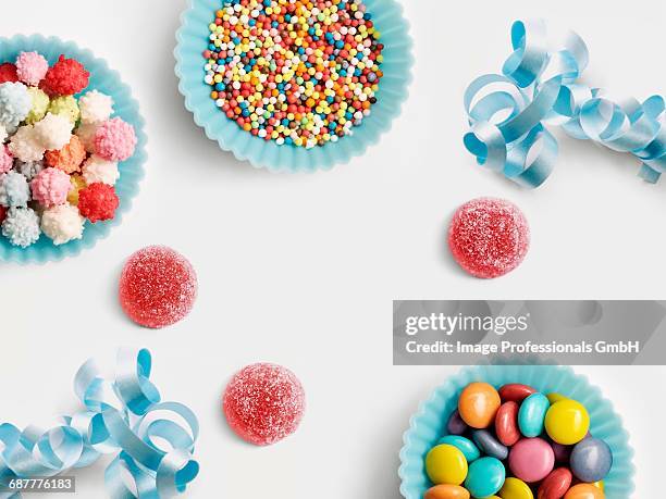 blue paper cups full of sugar balls for decorating cakes - vermicelli stock pictures, royalty-free photos & images