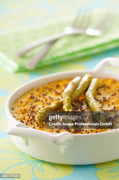 carrot flan with asparagus and poppyseeds - flan stock pictures, royalty-free photos & images