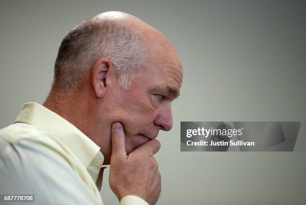 Republican congressional candidate Greg Gianforte looks on during a campaign meet and greet at Lambros Real Estate on May 24, 2017 in Missoula,...