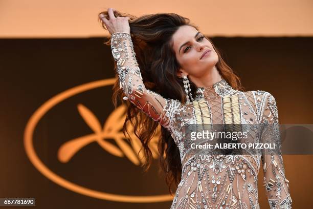 Brazilian model Izabel Goulart poses as she arrives on May 24, 2017 for the screening of the film 'The Beguiled' at the 70th edition of the Cannes...
