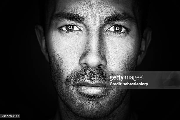 portrait of a mature man - people on black background stock-fotos und bilder
