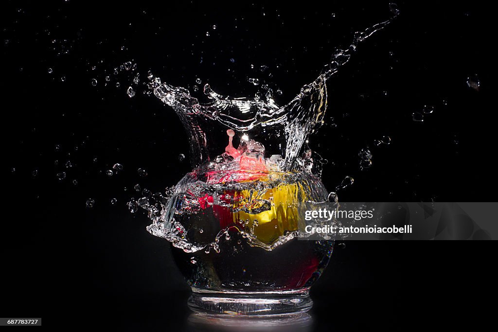 Water splashing in bowl of water