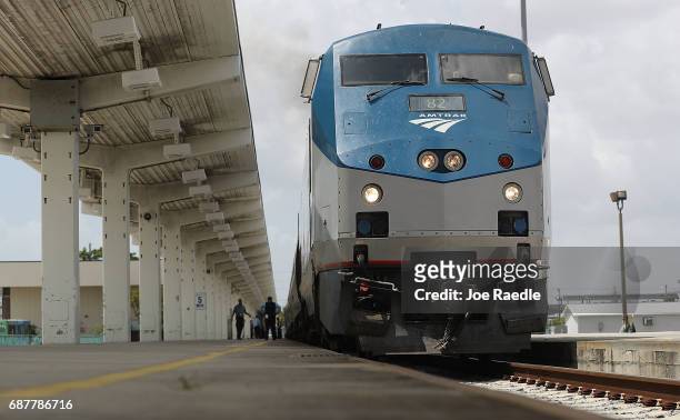 An Amtrak train is seen as people board at the Miami station on May 24, 2017 in Miami, Florida. President Donald Trump's budget proposal would...
