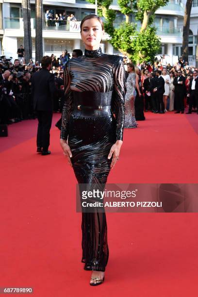 Russian model Irina Shayk poses as she arrives on May 24, 2017 for the screening of the film 'The Beguiled' at the 70th edition of the Cannes Film...