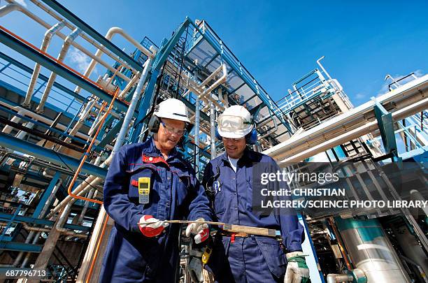 oil and gas workers at refinery - refinery stock pictures, royalty-free photos & images