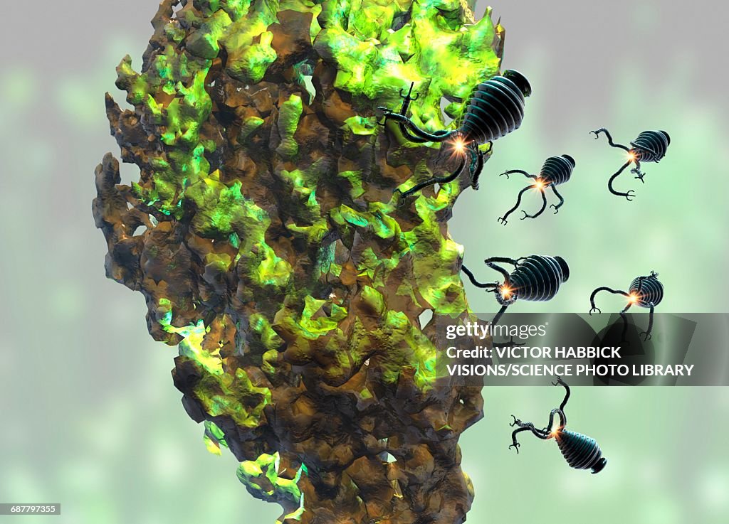 Nanobots attacking cancer cell, illustration