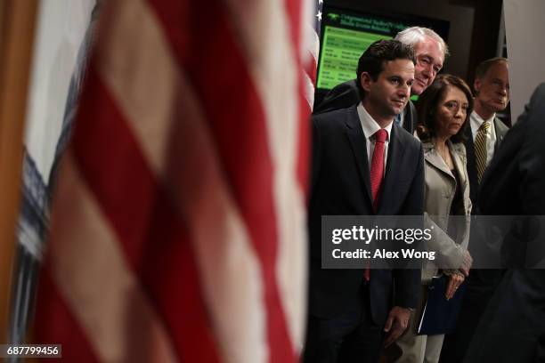 Sen. Brian Schatz , Sen. Edward Markey , Sen. Maria Cantwell and Sen. Tom Carper listen during a news conference at the Capitol May 24, 2017 in...