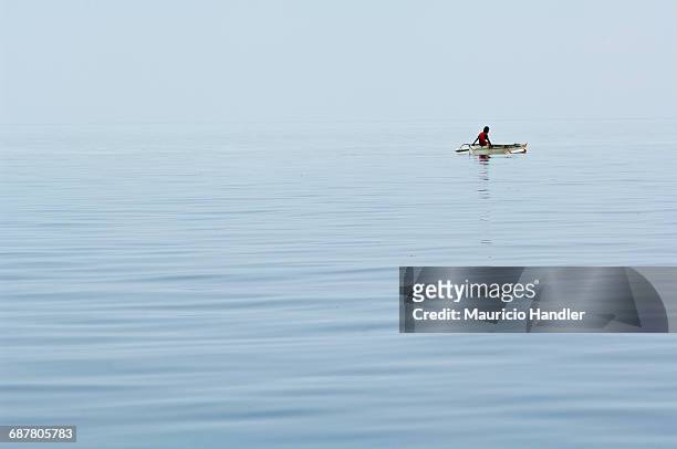 a bajau sea gypsy fisherman in waters off mabul island, sabah, malaysia. - bajau stockfoto's en -beelden