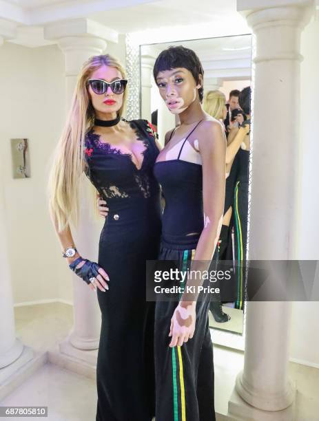 Paris Hilton with Winnie Harlow backstage at the Philipp Plein Cruise Show 2018 during the 70th annual Cannes Film Festival at on May 24, 2017 in...
