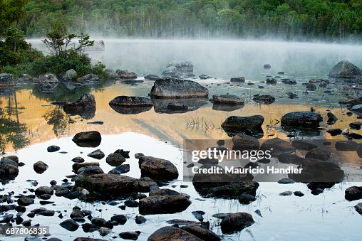 Mist on Sandy Stream Pond during sunrise in Baxter State Park, Maine. Mist on Sandy Stream Pond during sunrise in Baxter State Park, Maine.