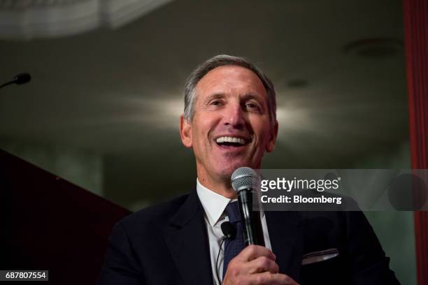 Howard Schultz, chairman and founder of Starbucks Corp., smiles during a conference at the Economic Club of New York in New York, U.S., on Wednesday,...