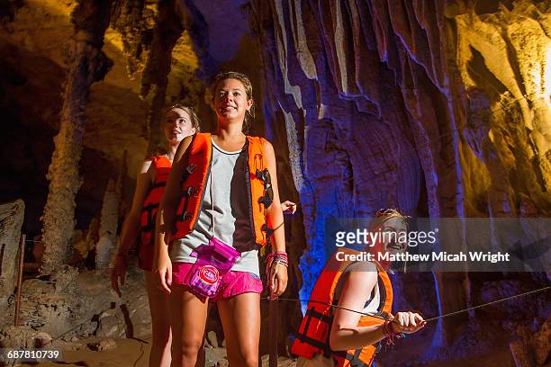 exploring underground caves in kong lor. - espeleología fotografías e imágenes de stock