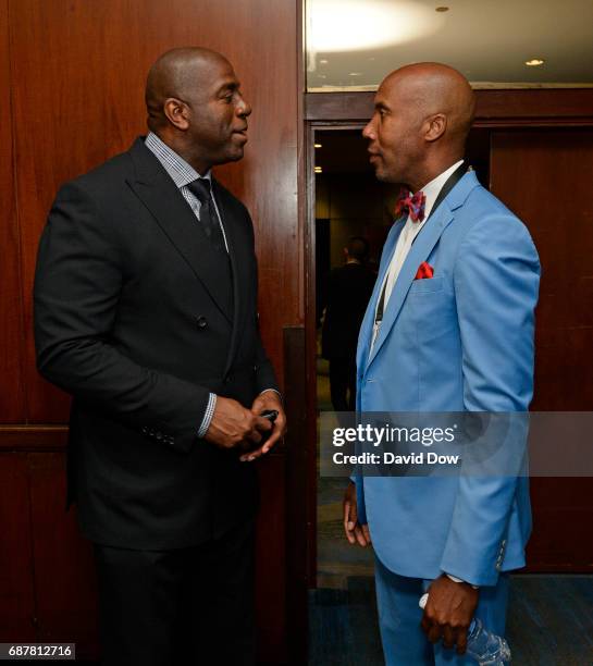 Magic Johnson of the Los Angeles Lakers talks with Former NBA player, Bruce Bowen during the 2017 NBA Draft Lottery at the New York Hilton in New...