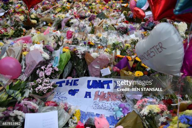 Carpet of flowers and messages lie at St Ann's Square in Manchester, northwest England on May 24 placed in tribute to the victims of the May 22...