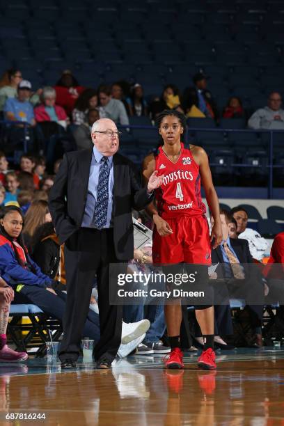 Mike Thibault talks with Tayler Hill of the Washington Mystics during the game against the Chicago Sky goes to the basket against the Washington...