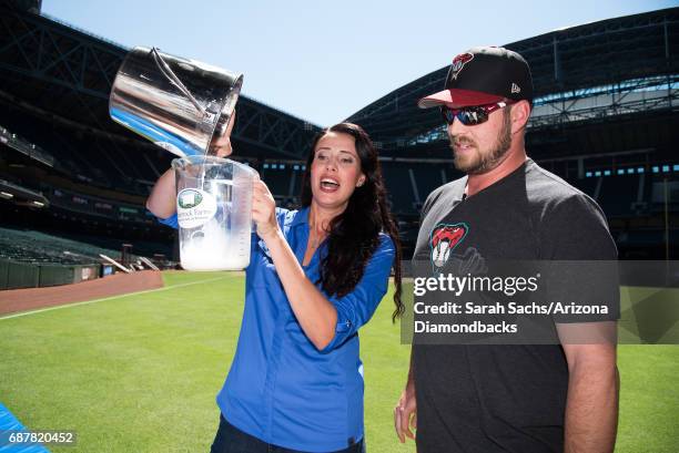 Hoover of the Arizona Diamondbacks competes in a cow-milking contest before the game against the Chicago White Sox at Chase Field on May 23, 2017 in...