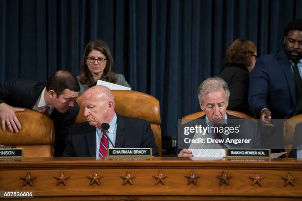 Committee chairman Rep. Kevin Brady and ranking member Rep. Richard Neal confer with aides before the start of a House Ways and Means Committee...