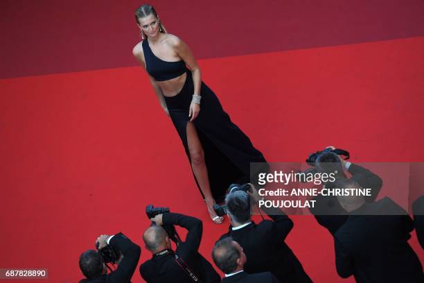 German model Toni Garrn poses as she arrives on May 24, 2017 for the screening of the film 'The Beguiled' at the 70th edition of the Cannes Film...