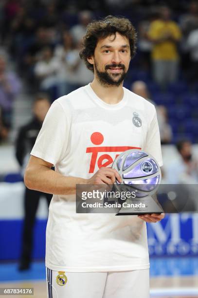 Sergio Llull, #23 guard of Real Madrid receives the best guard trophy of Liga Endesa during the Liga Endesa Play off game between Real Madrid and...