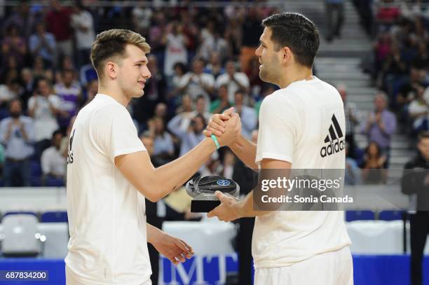 Luka Doncic, #7 guard of Real Madrid receives the best young player trophy of Liga Endesa during the Liga Endesa Play off game between Real Madrid...