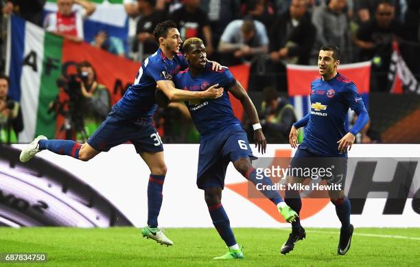 Paul Pogba of Manchester United celebrates scoring his sides first goal with Henrikh Mkhitaryan of Manchester United and Matteo Darmian of Manchester...