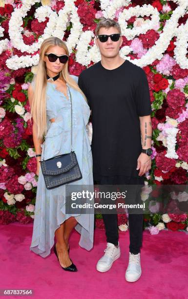 Paris Hilton and Chris Zylka attends the/walks the runway at the Philipp Plein Cruise Show 2018 during the 70th annual Cannes Film Festival at on May...