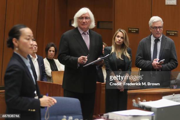 Prosecutor Chadd Kim speaks as attorney Thomas Mesereau, model Dani Mathers and attorney Dana M. Cole stand during court proceedings for a hearing at...