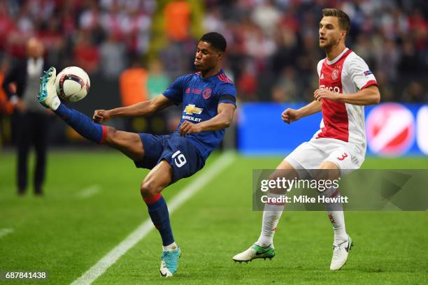 Marcus Rashford of Manchester United and Joel Veltman of Ajax in action during the UEFA Europa League Final between Ajax and Manchester United at...