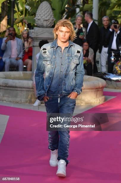 Model Jordan Barrett wearing Philipp Plein walk the runway at the Philipp Plein Cruise Show 2018 during the 70th annual Cannes Film Festival at on...