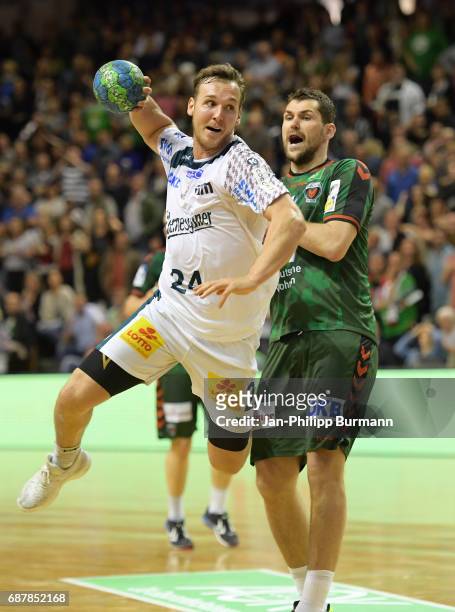 Christian O´Sullivan of SC Magdeburg and Jakov Gojun of Fuechse Berlin during the game between Fuechse Berlin against the SC Magdeburg on may 24,...