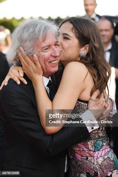 Director Jacques Doillon and Izia Higelin depart after the "Rodin" screening during the 70th annual Cannes Film Festival at Palais des Festivals on...