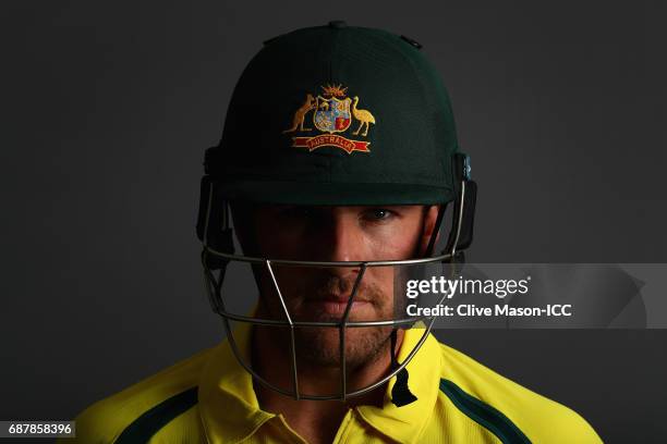 Aaron Finch of Australia poses during a portrait session ahead of the ICC Champions Trophy at the Royal Garden Hotel on May 24, 2017 in London,...