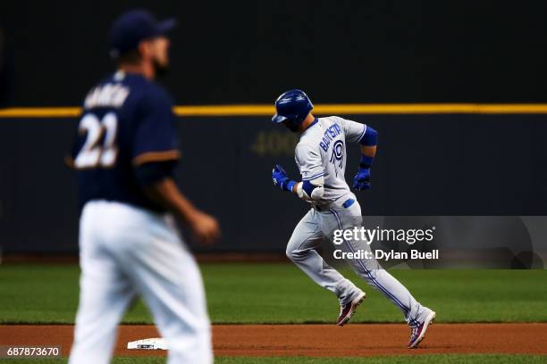 Jose Bautista of the Toronto Blue Jays rounds the bases after hitting a home run off of Matt Garza of the Milwaukee Brewers in the fourth inning at...