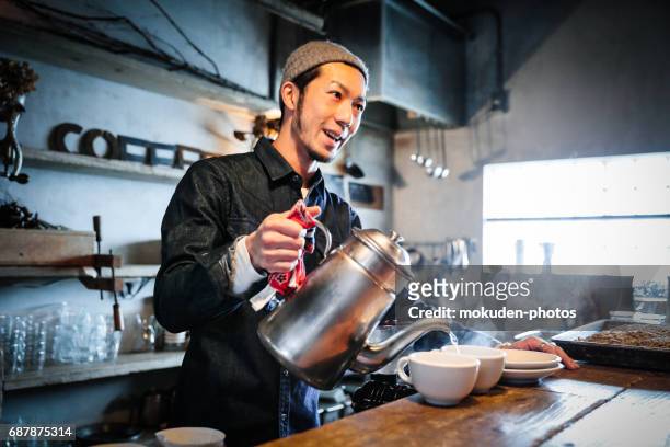 confident young male happy cafe owner - 医療とヘルスケア stock pictures, royalty-free photos & images