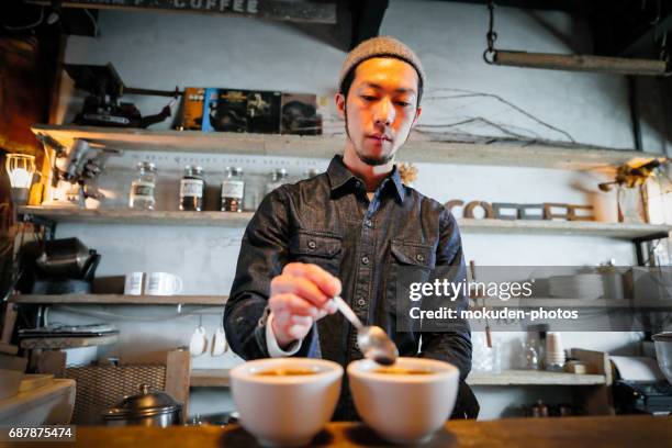 confident young male happy cafe owner - ミッドアダルト stock pictures, royalty-free photos & images