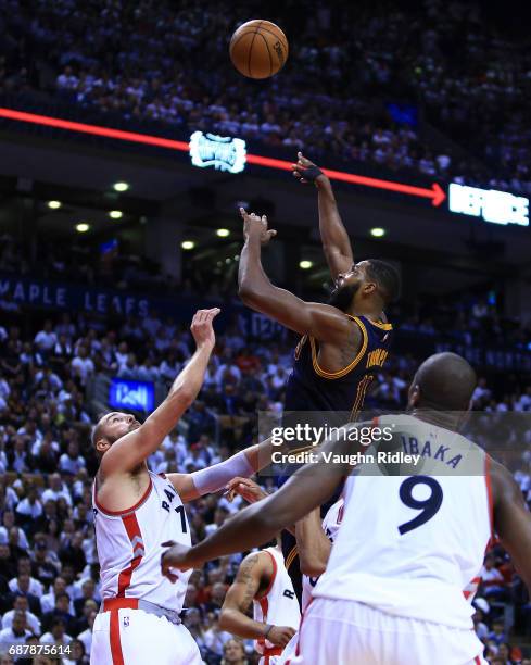 Tristan Thompson of the Cleveland Cavaliers shoots the ball as Jonas Valanciunas of the Toronto Raptors defends in the second half of Game Three of...