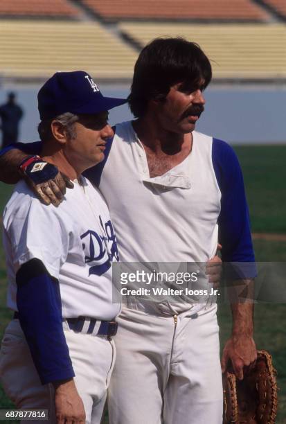 Closeup portrait of Los Angeles Dodgers manager Tommy Lasorda on field with Bill Buckner during spring training at Dodger Stadium. Los Angeles, CA...