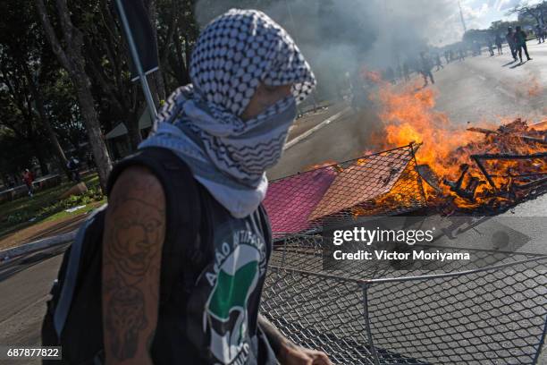 Protesters set fire to furniture outside the Ministery of Agriculture during a clash with police over direct elections in Planalto, on May 24, 2017...