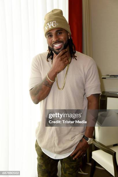 Singer Jason Derulo poses during a photo session to present his new record '777' at Waldorf Astoria on May 24, 2017 in Berlin, Germany.