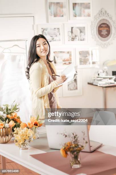 event planner in her studio - computer wedding stock pictures, royalty-free photos & images