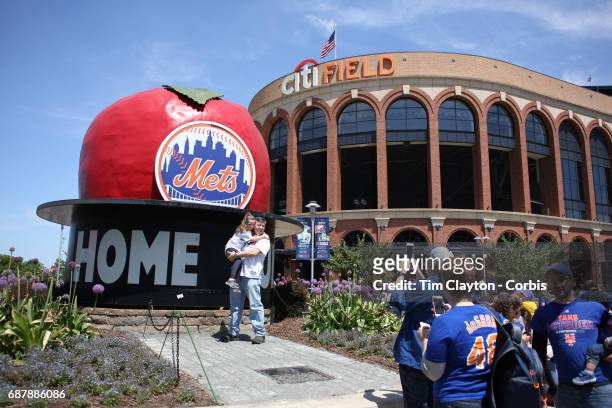 May 21: Fans take pictures of themselves in front of the home run apple outside Citi Field, home of the New York Mets before the Los Angeles Angeles...